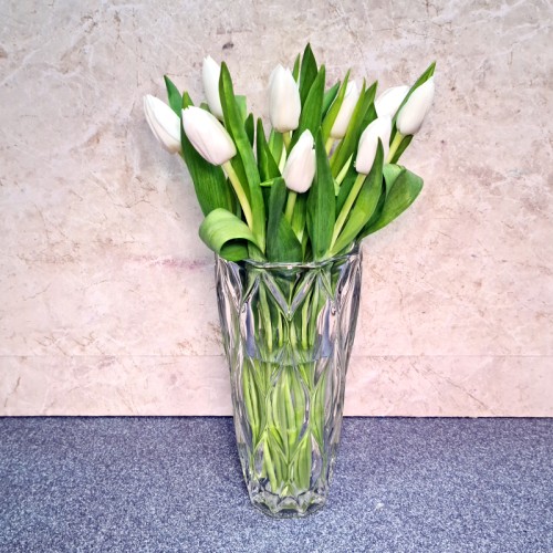 crystal vase with ten white tulips crystal vase with ten white tulips